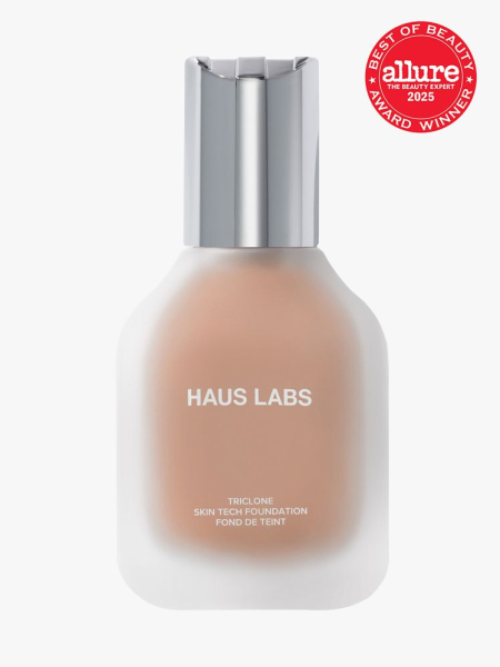 Haus Labs Triclone Skin Tech Medium Coverage Foundation in frosted glass bottle with silver cap on light gray background with red Allure Best of Beauty seal in the top right corner
