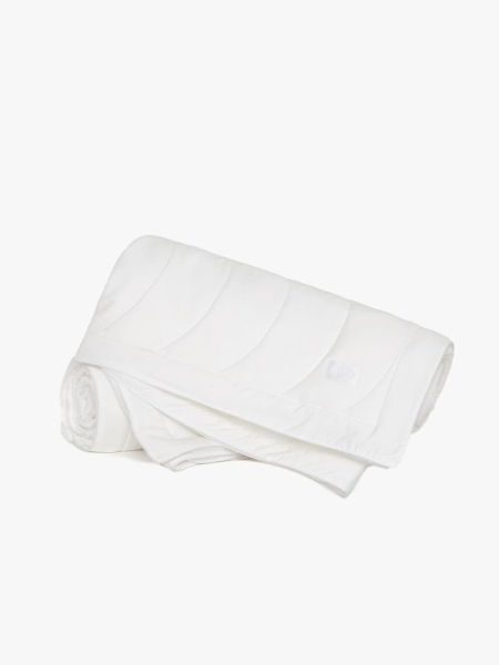 Buffy Breeze Comforter in white folded on gray background