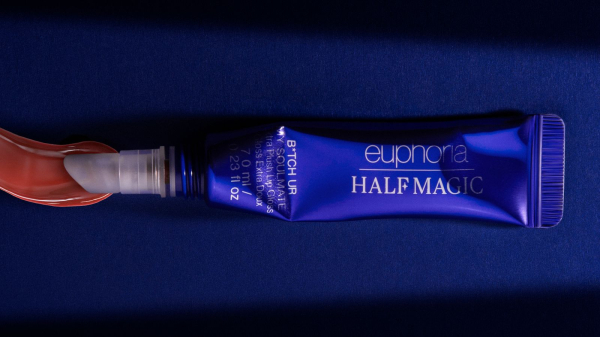 An opened squeezed tube of lip gloss from the Half Magic x Euphoria collection