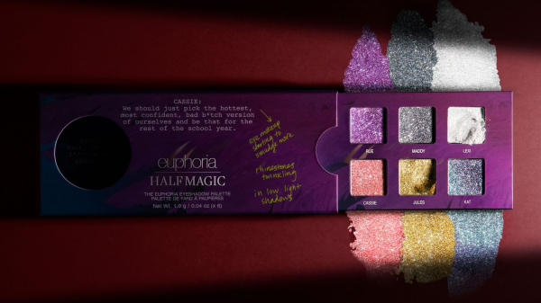 The Half Magic x Euphoria eye shadow palette against a red background