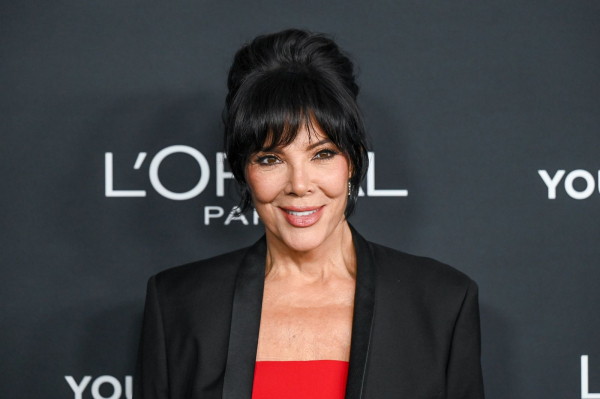 Image may contain Kris Jenner Black Hair Hair Person Adult Head Face Clothing Coat Photography and Portrait