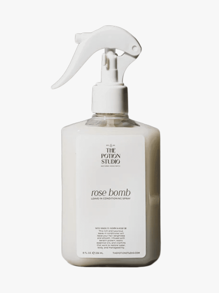 The Potion Studio's Rose Bomb Leave-In in branded spray bottle component on a light gray background