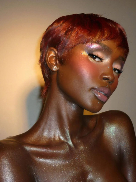 body glitter and rainbow eye shadow